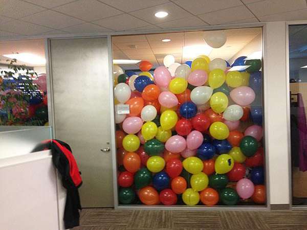 17.) Throw coworkers a surprise party... with extra balloons